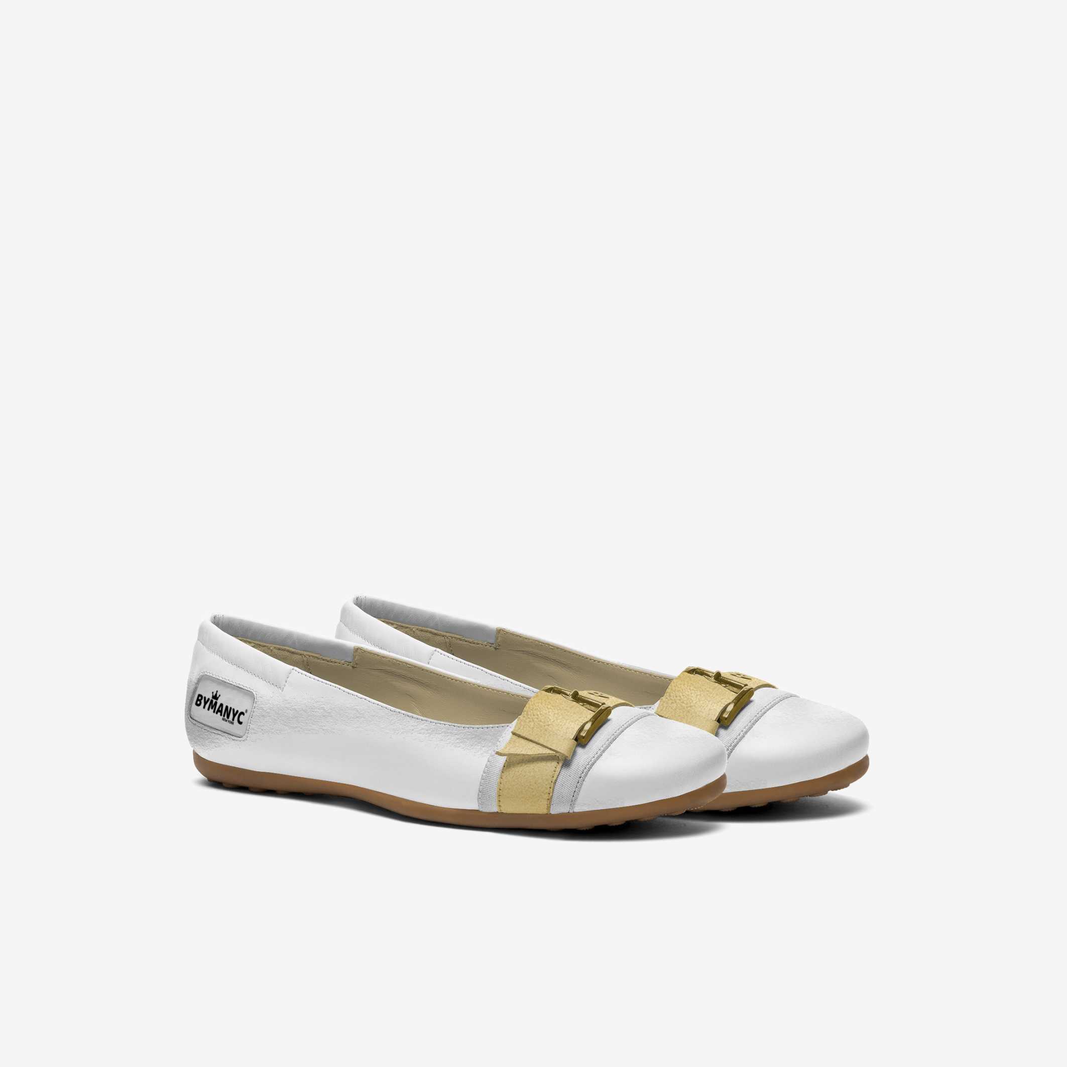 White shoes with gold accents on a white background