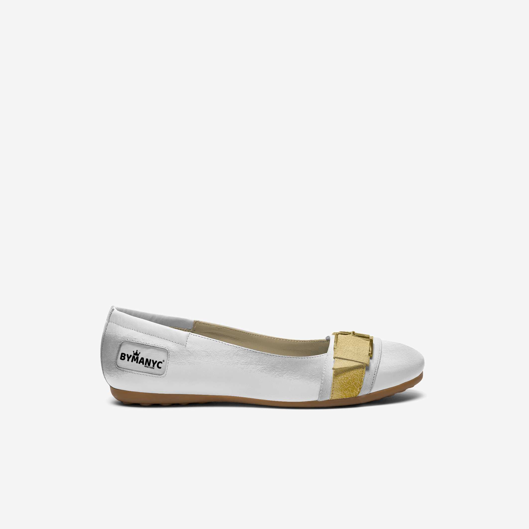 White flat shoe with gold accent on a white background