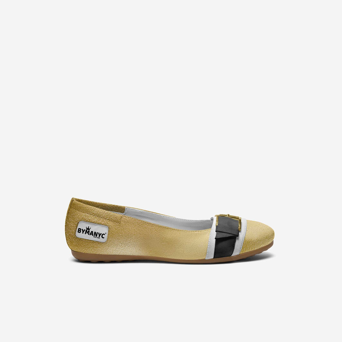 Beige flat shoe with a black accent on a white background