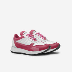 Pink and white sneaker with visible brand name on a white background