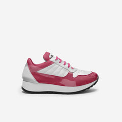 Pink and white sneaker on a light gray background