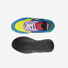 Colorful sneaker with a focus on the sole on a light gray background