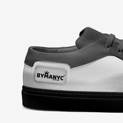 Gray and white sneaker with 'BYPANYC' logo on a light gray background