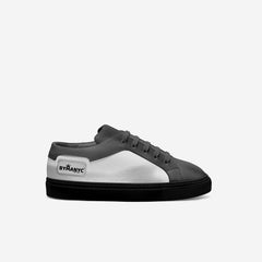 Gray and white sneaker with 'BYMANYC' branding on a light gray background