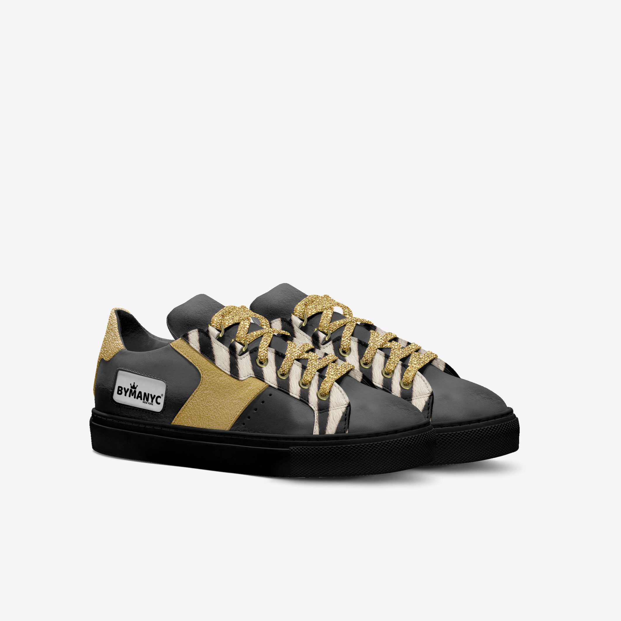 Black and gold sneaker with striped pattern on a white background