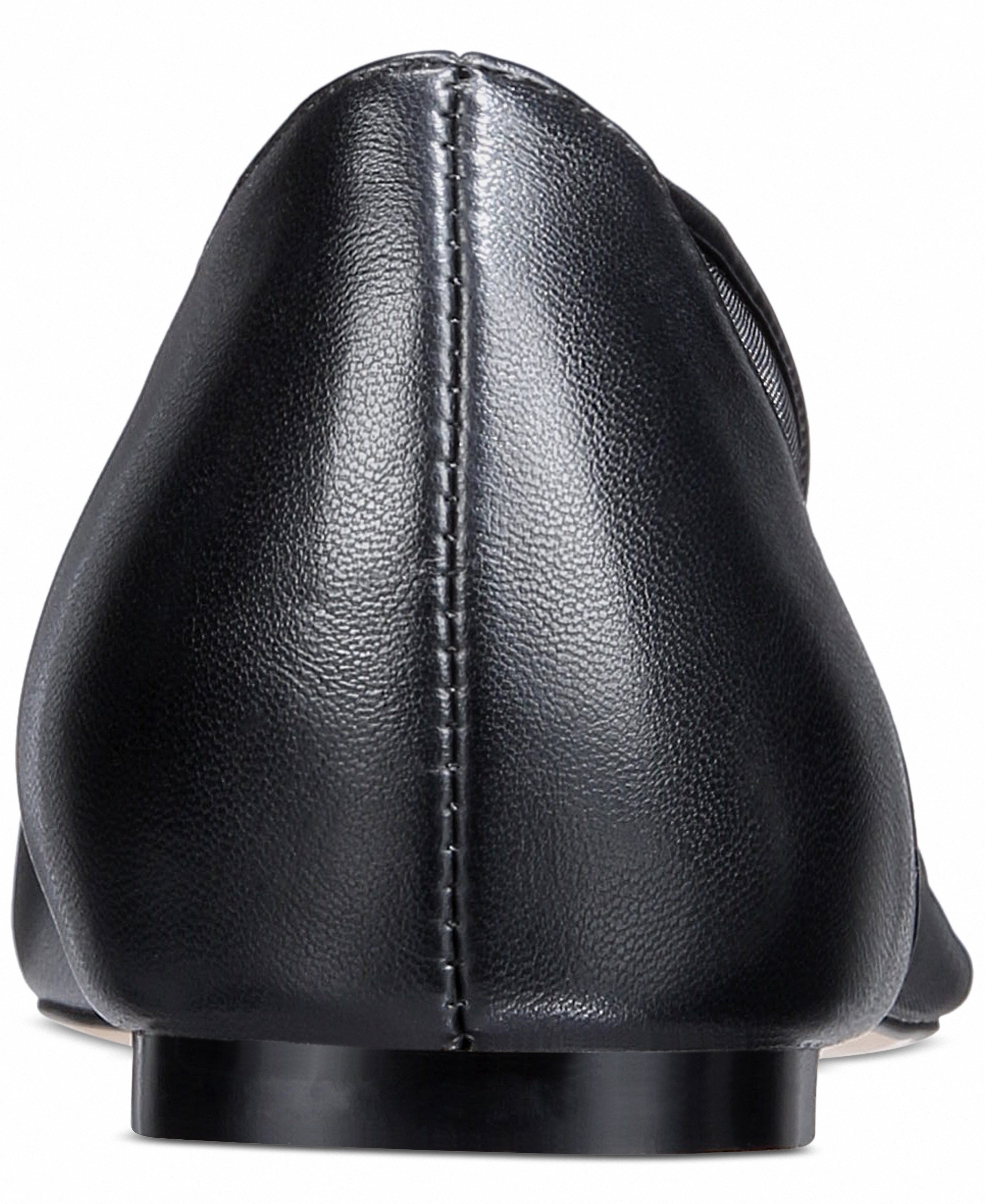 Black leather loafer shoe on a white background