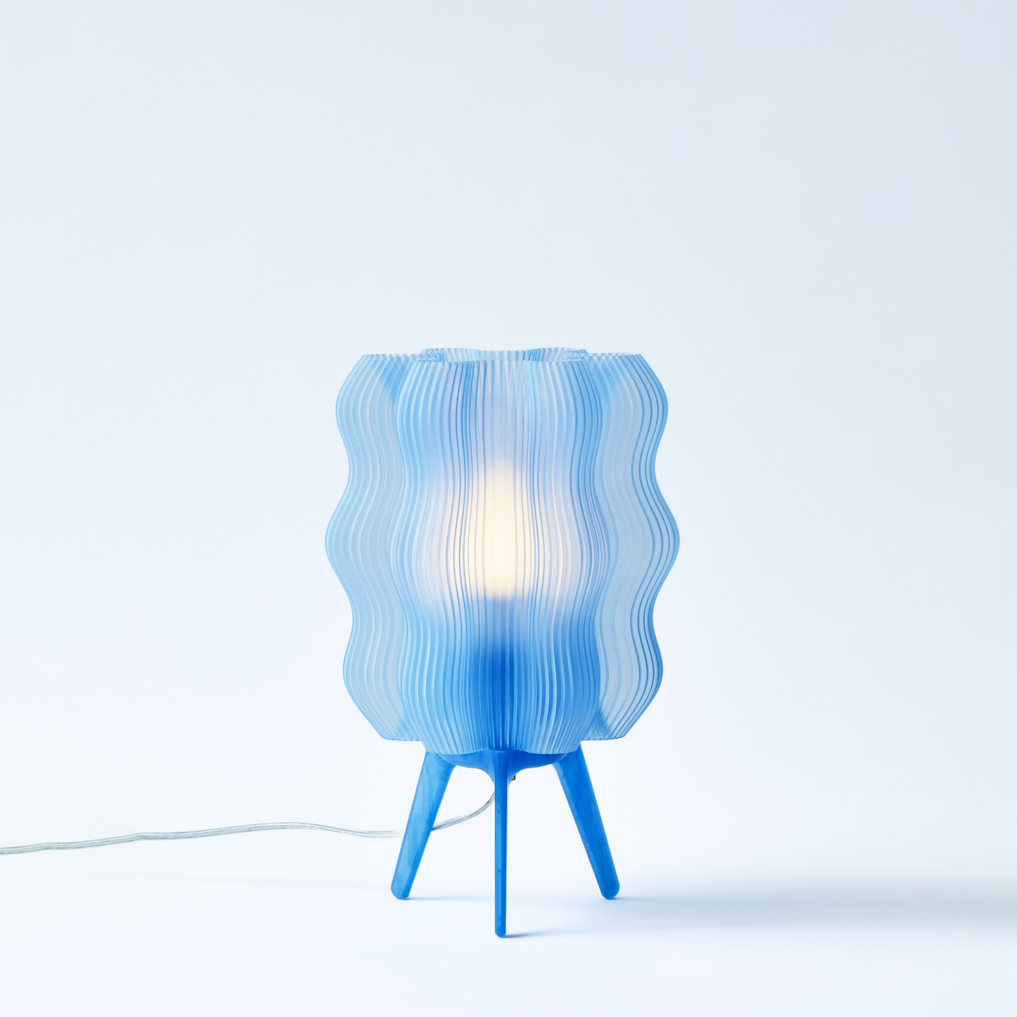 Blue textured table lamp on a white background
