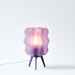 Purple textured table lamp on a white background