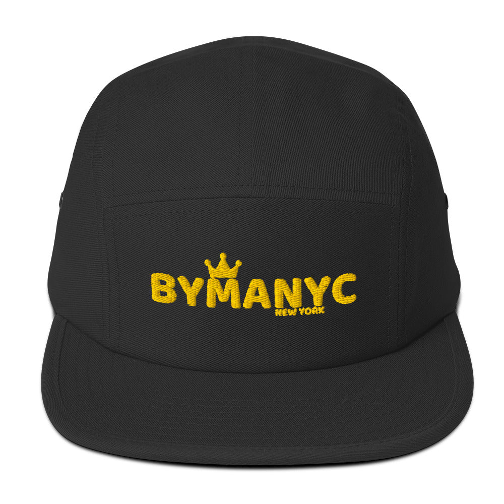 Black cap with yellow 'BYMANYC' logo on a white background