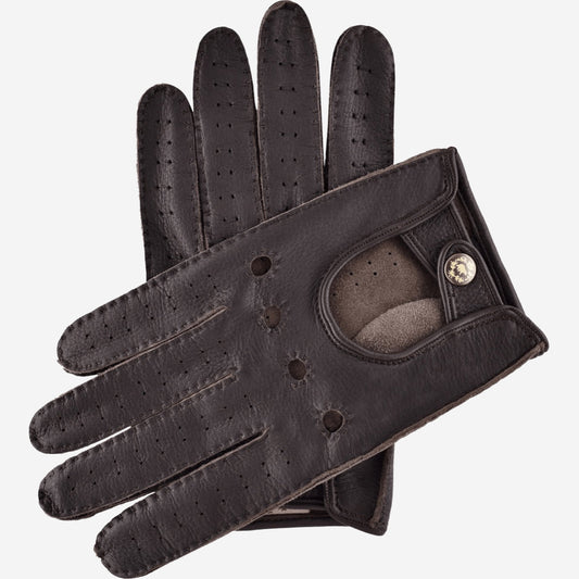 Black leather driving glove with a button on a white background