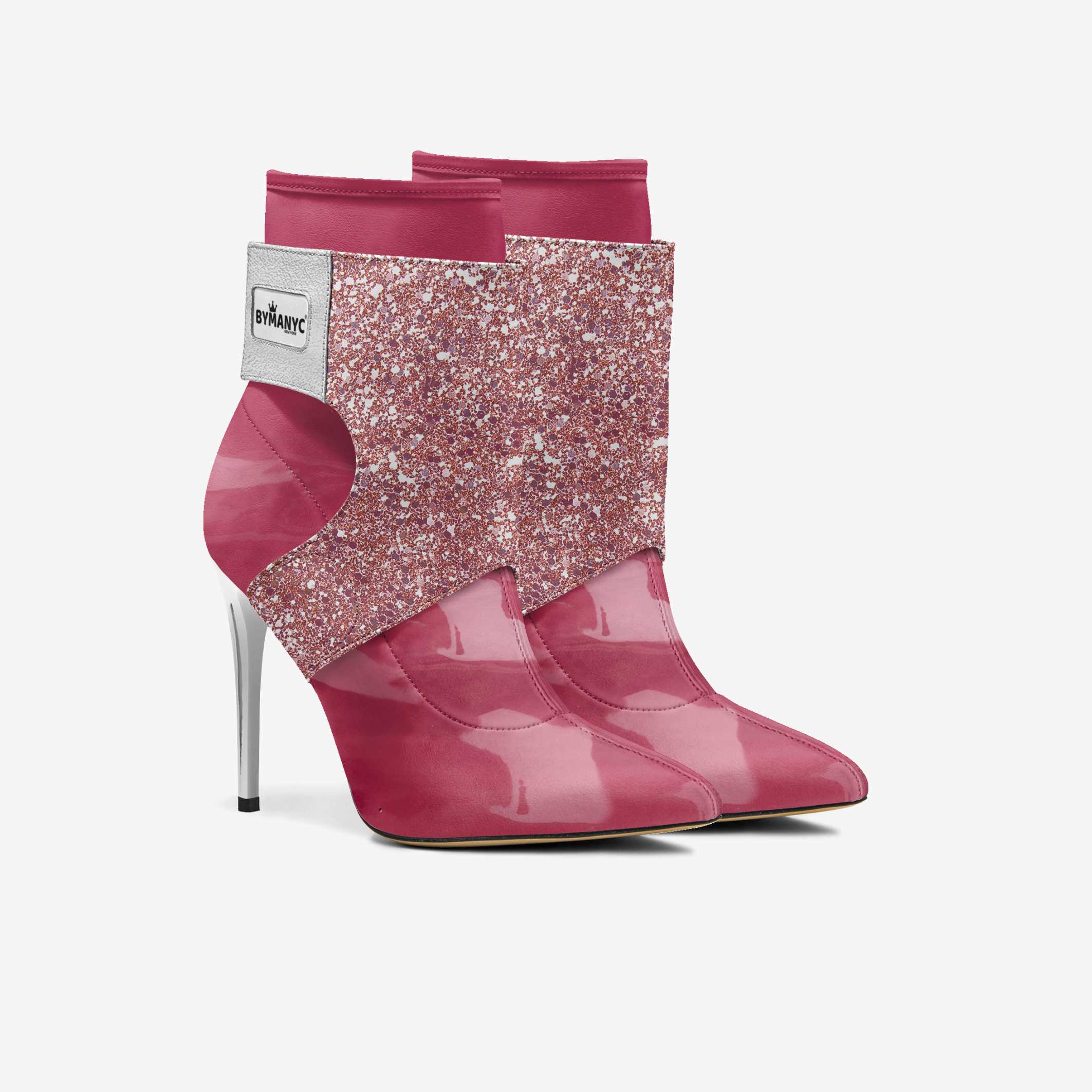 Pink high-heeled boots with glittery design on a light gray background