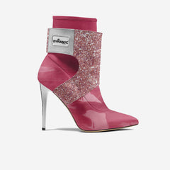 Pink high-heeled boot with glittery design and 'BYMANYC' label on a white background