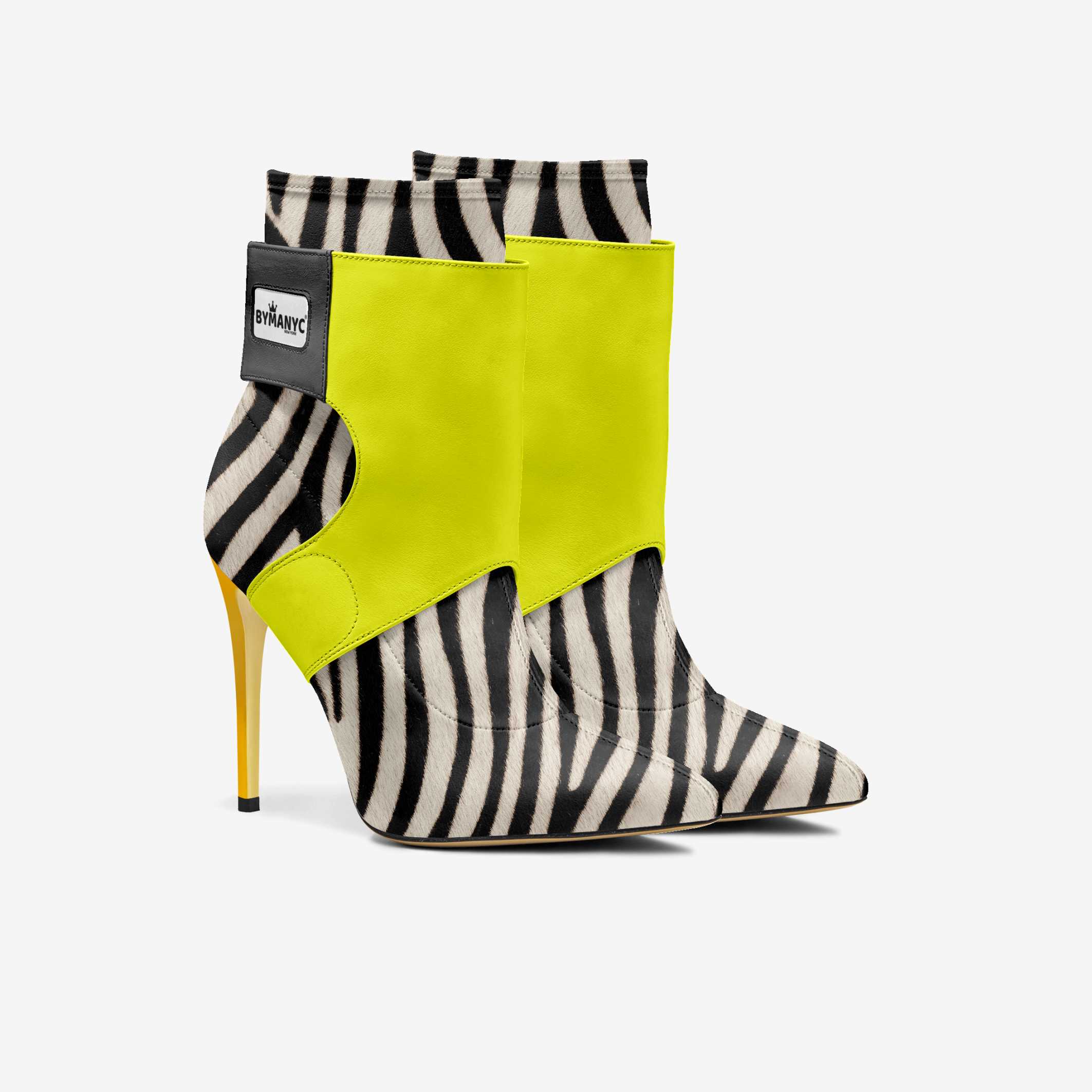 Zebra-patterned high-heeled boots with bright yellow accents on a white background