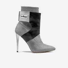 High-heeled ankle boot with patterned design and ByManyc label on a white background