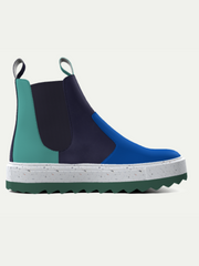 Multicolored Chelsea boot with a white sole on a light gray background