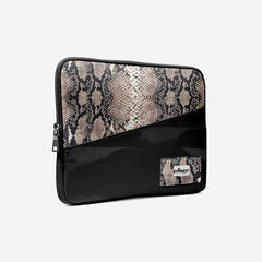 Black and snake print clutch bag on a white background