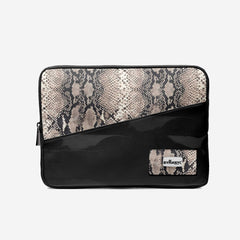 Black and snake print clutch bag with ByTancy logo on a light gray background