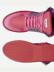 Pink high-top sneaker with gold accents on a white background