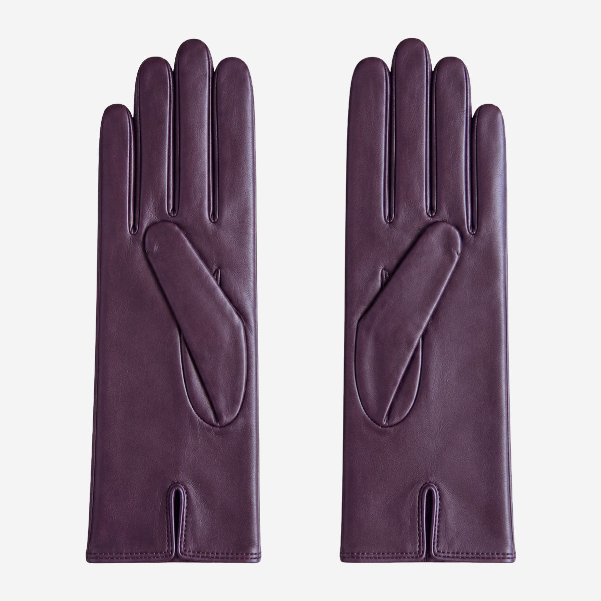 Pair of purple leather gloves on a light gray background