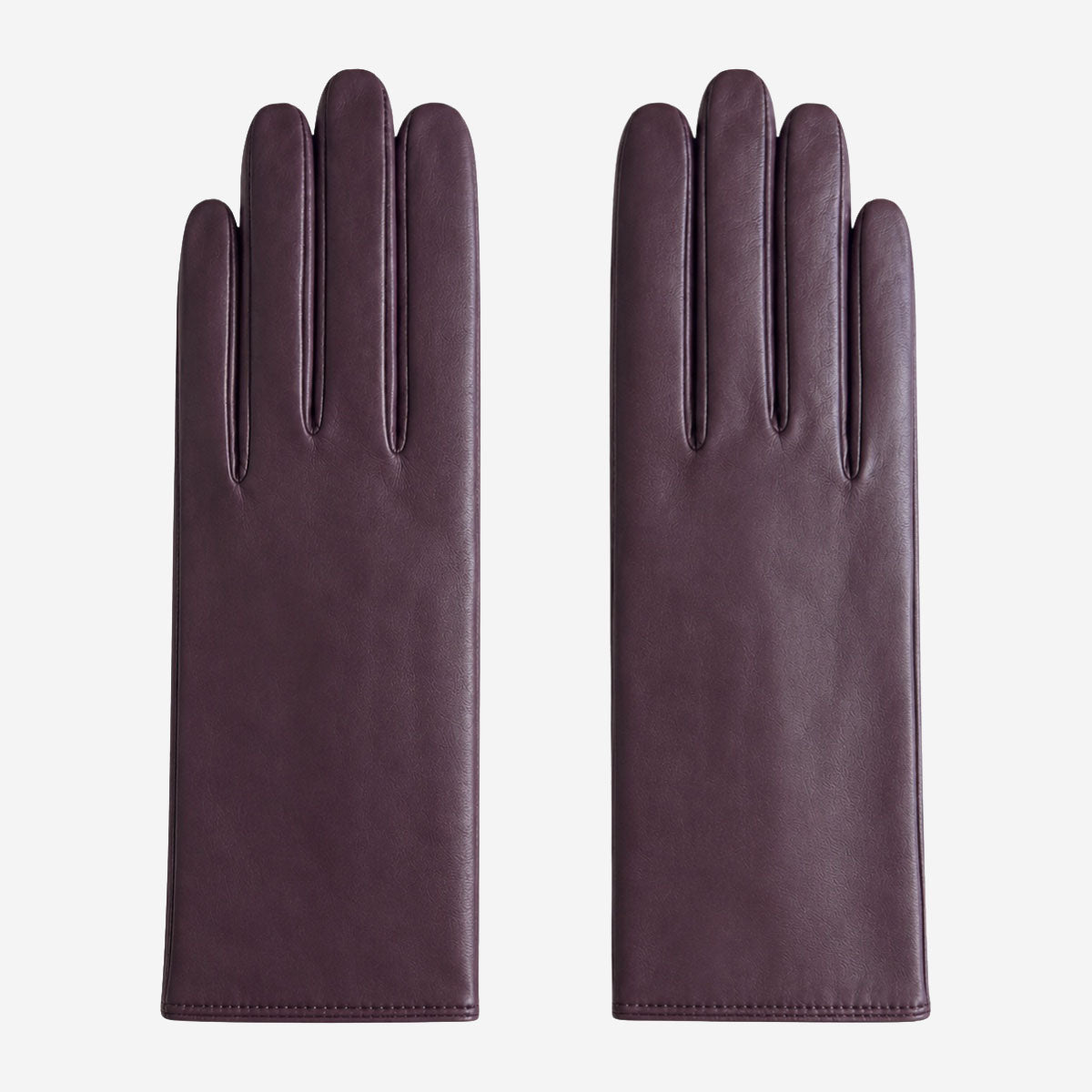 Pair of dark purple leather gloves on a white background
