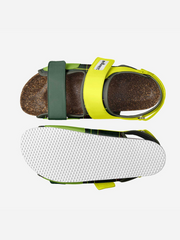 Sandal with green strap and yellow sole on a white background