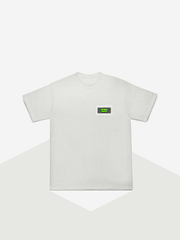 White t-shirt with a small green logo on a white background