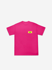 Pink t-shirt with a small yellow and red logo on a white background