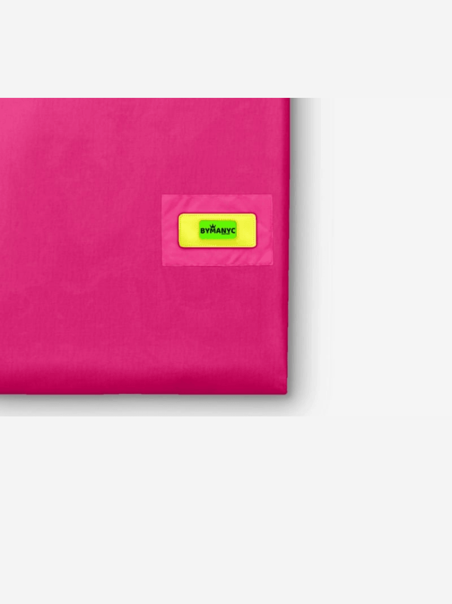 Pink fabric with a yellow label on a white background