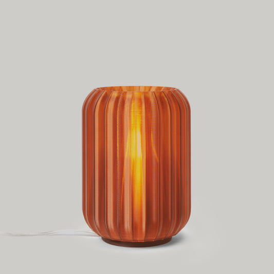 Decorative lamp with ribbed design on a plain background