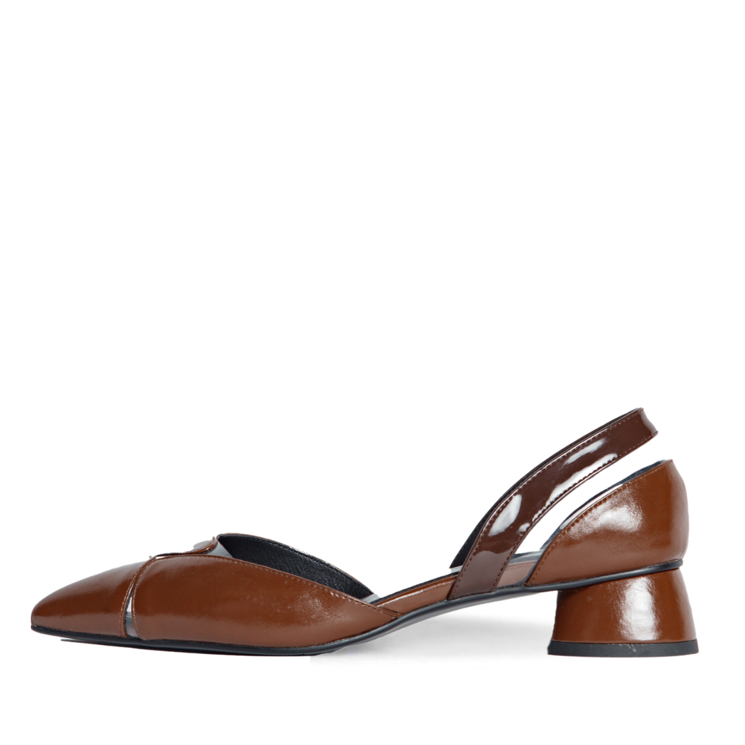Brown shoe with a small heel on a white background