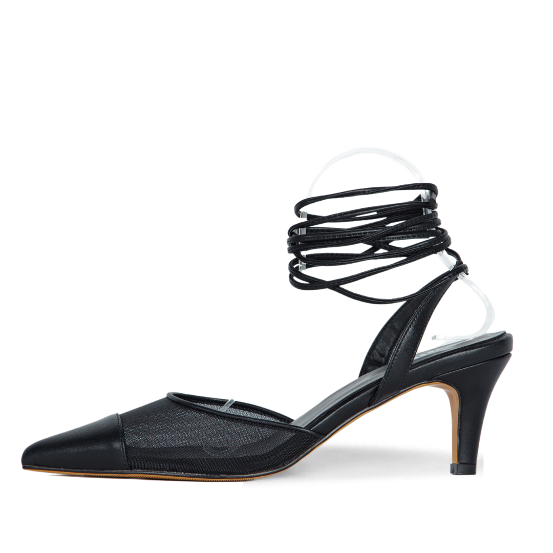 Black strappy high-heeled shoe on a white background