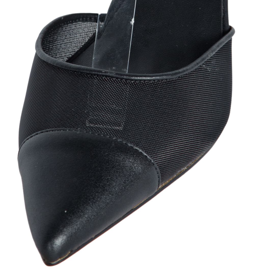 Black pointed-toe shoe on a white background