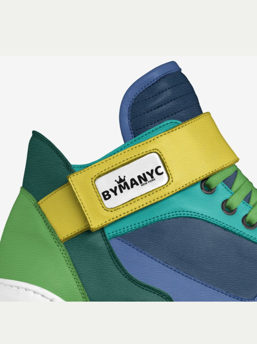 Colorful sneaker with a yellow strap displaying 'BYMANYC' on a white background