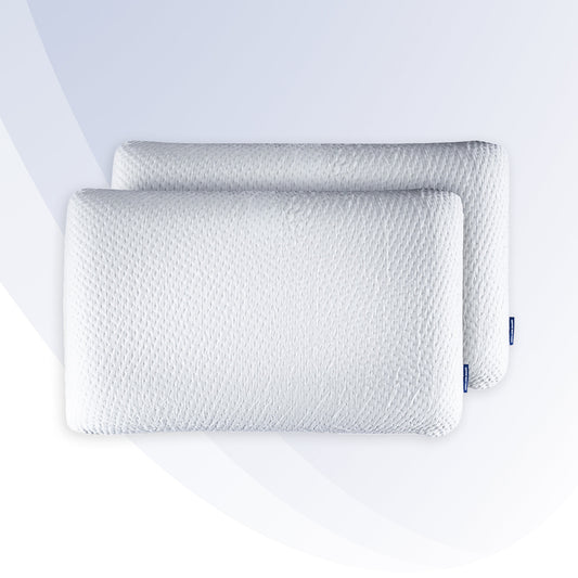 Two white pillows with a textured pattern on a light gray background