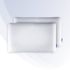 Two white pillows with a textured pattern on a light gray background