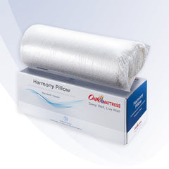 Roll of Harmony Pillow on OrthoMattress packaging with a white background