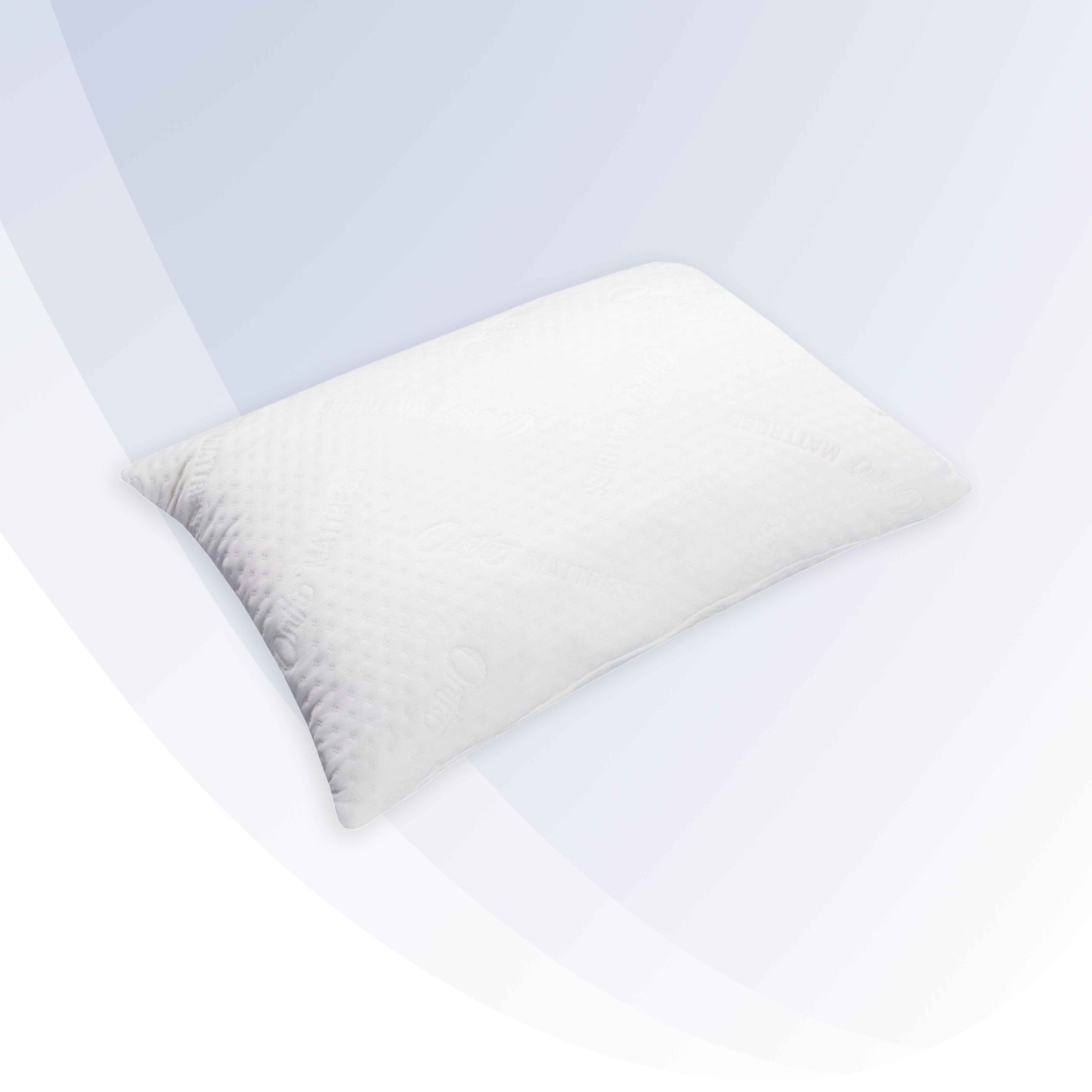 White pillow on a white bed with a light blue wall in the background