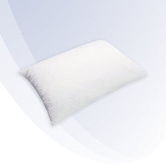 White pillow on a white bed with a light blue wall in the background