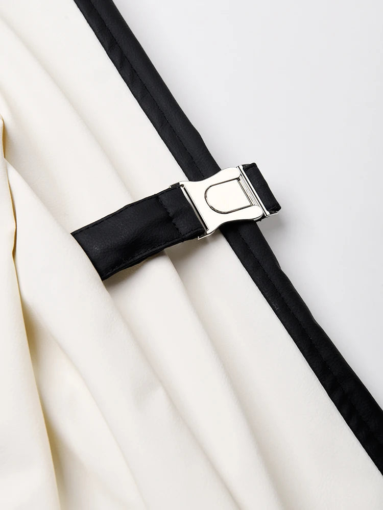 Black belt with a silver buckle on a white background