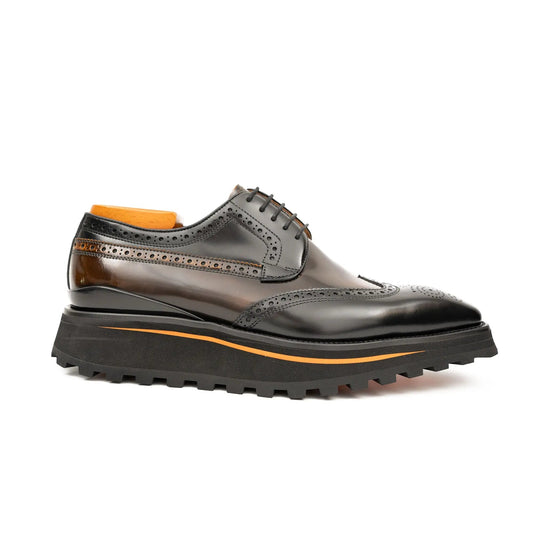 Dark brown leather shoe with orange lining on a white background