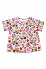 A pink short-sleeve t-shirt with a colorful school-themed print featuring yellow school buses, books, apples, and pencils, displayed flat against a white background.