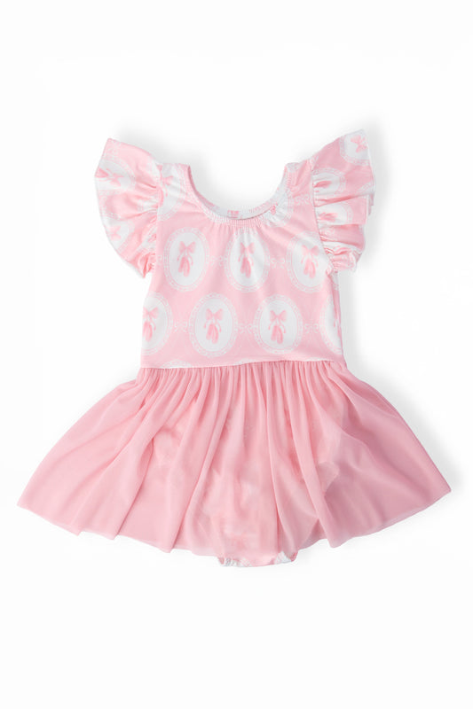 Pink dress with white text and ruffled sleeves on a white background