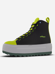 Black and green sneaker with a white sole on a light gray background