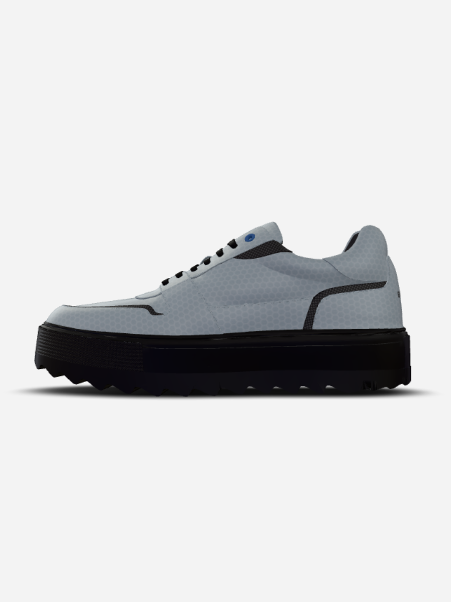 Gray sneaker with black sole on a white background