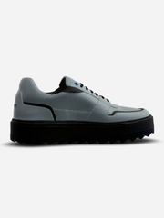 Gray sneaker with black sole on a white background