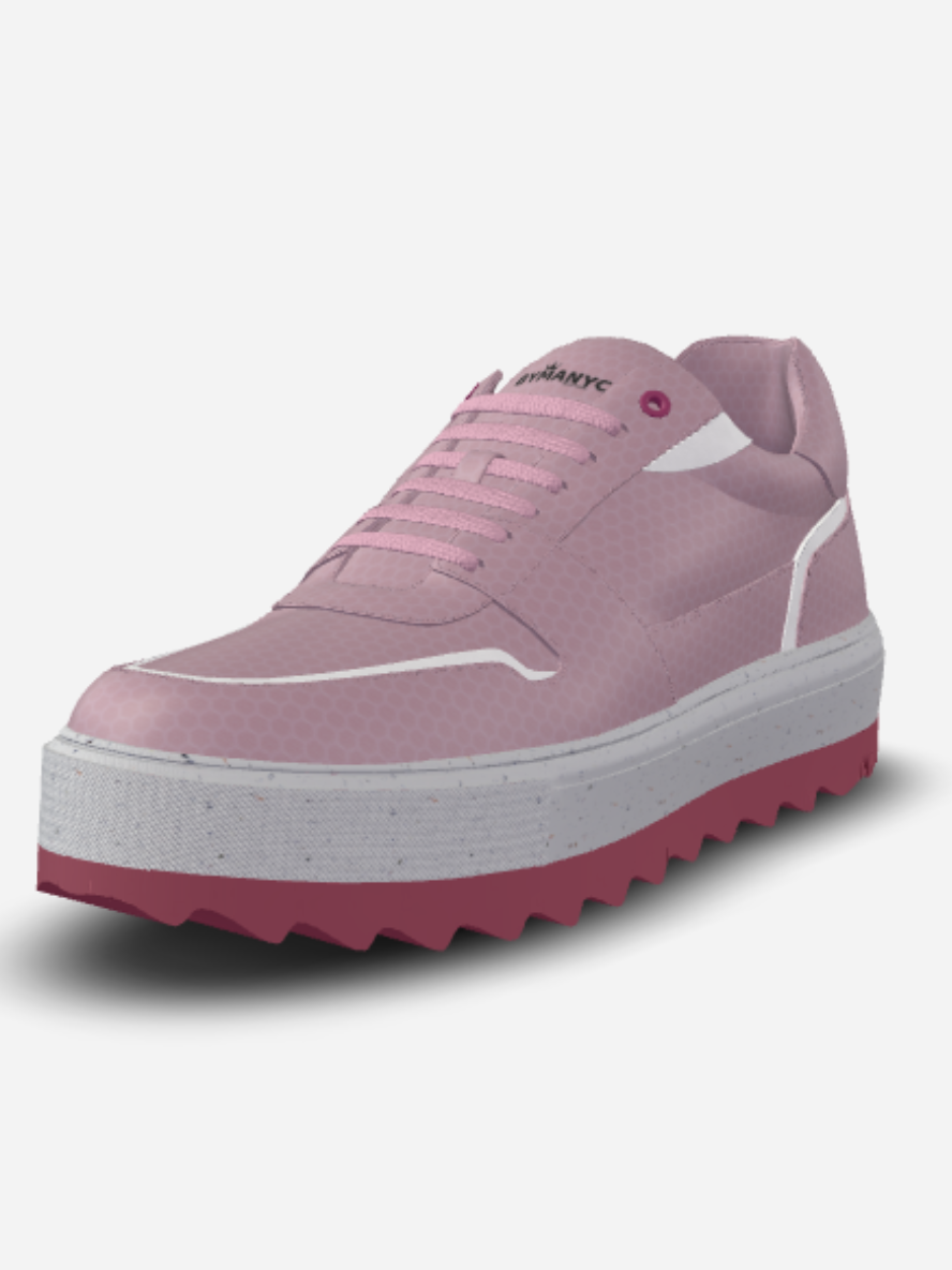Pink sneaker with a white sole on a light gray background