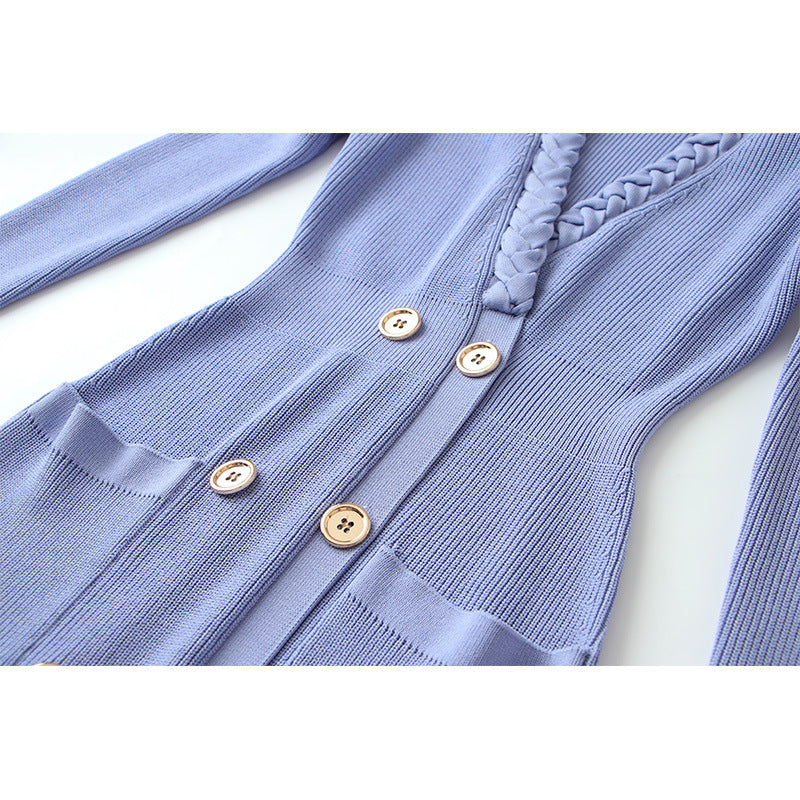 Blue ribbed cardigan with button details on a white background