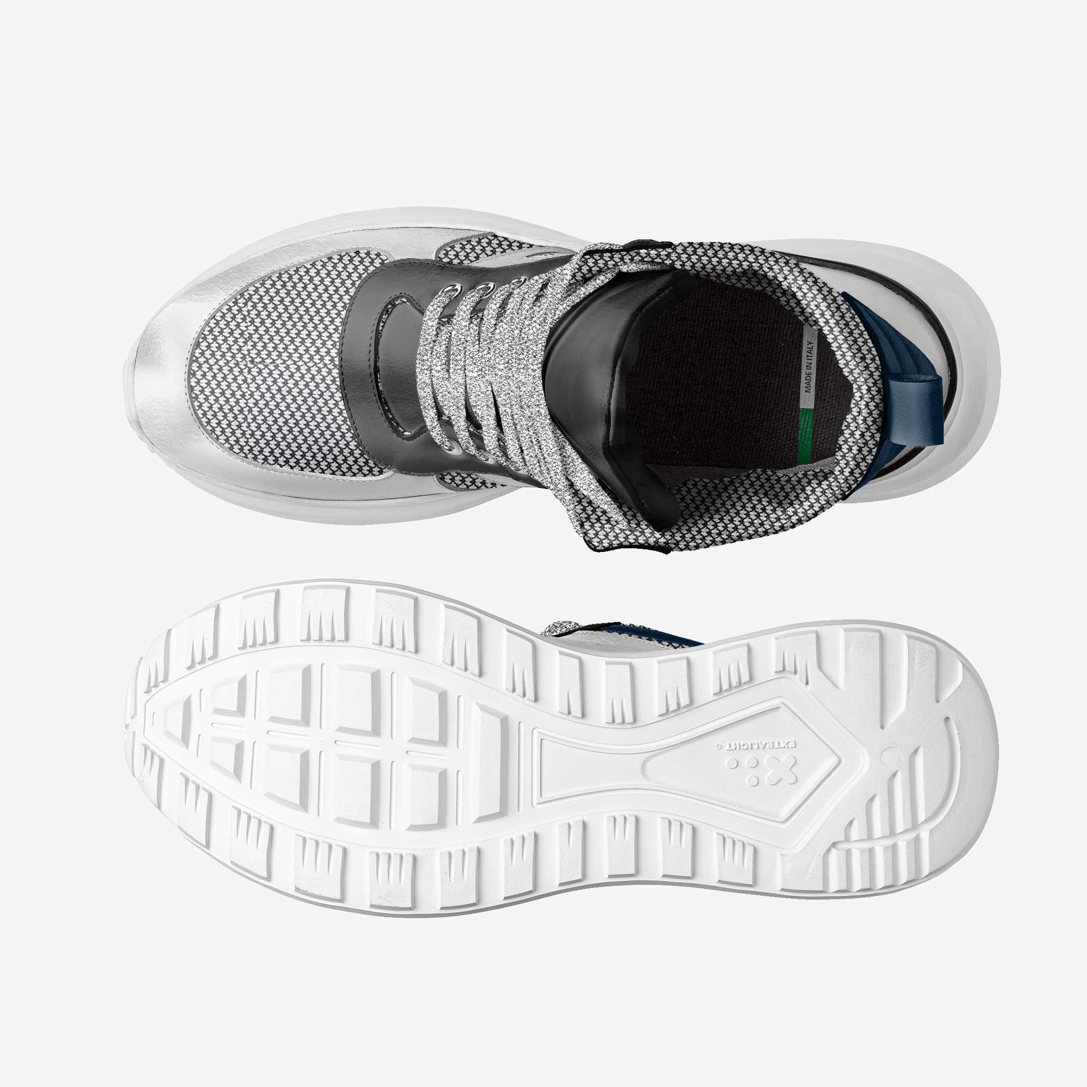 White athletic shoe with a textured sole on a white background