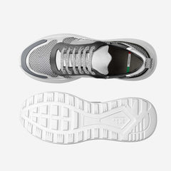 Gray sneaker with white sole on a light gray background