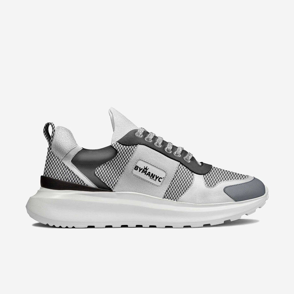 Gray and black sneaker with 'BY MANYC' branding on a white background